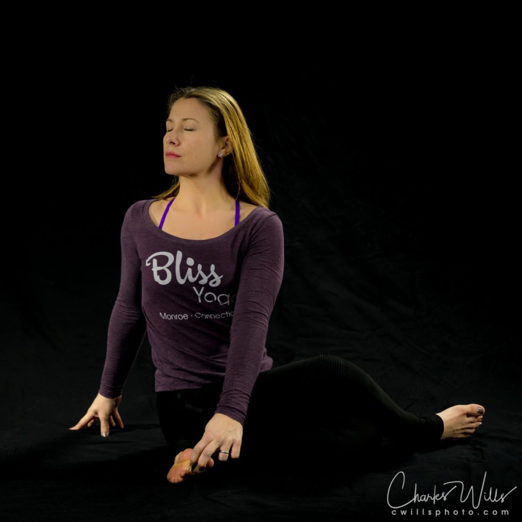 Seated Spinal Twist with legs in Cow Face Pose